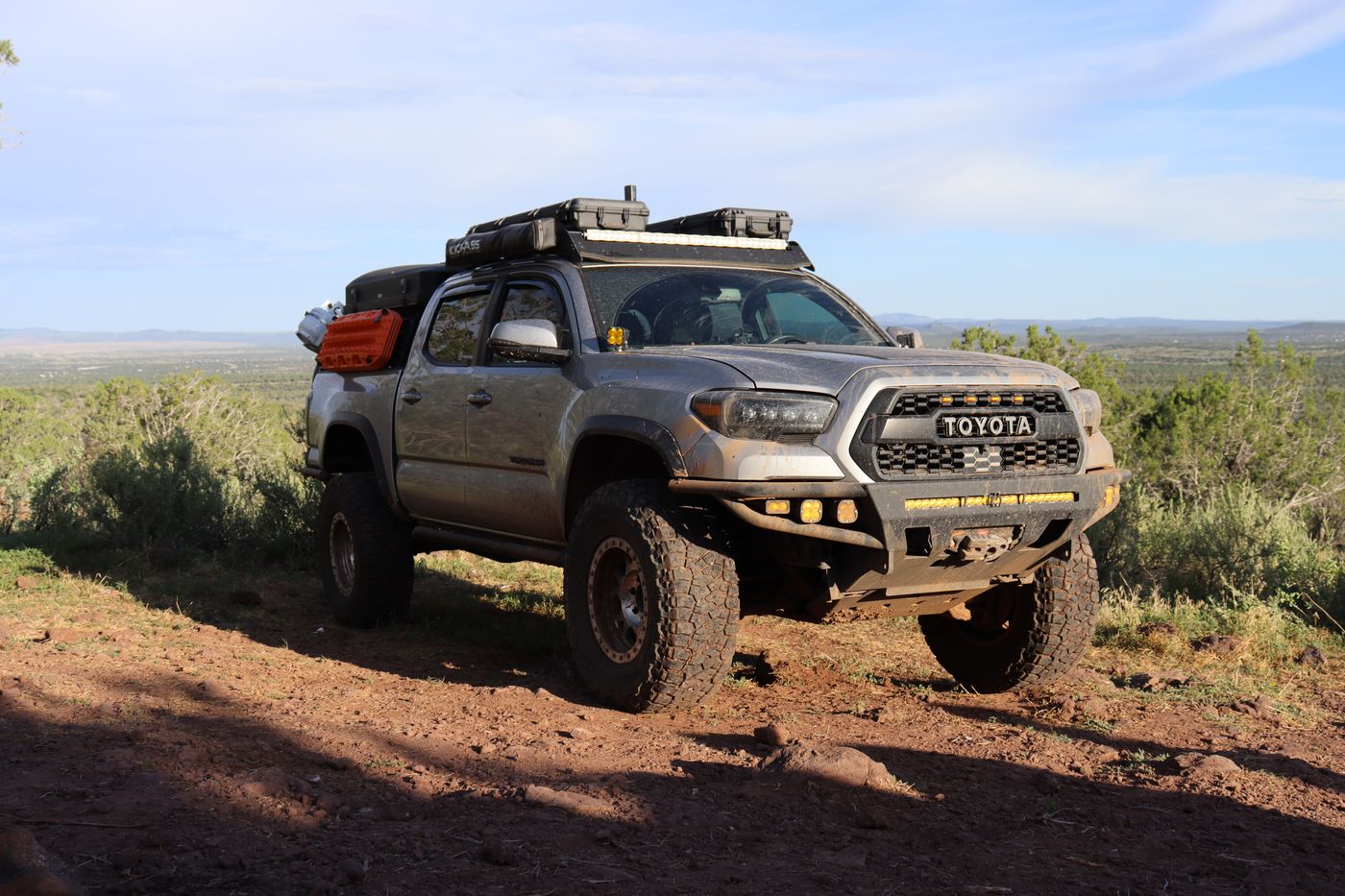 Tacoma parked on a high-desert overlook at golden hour